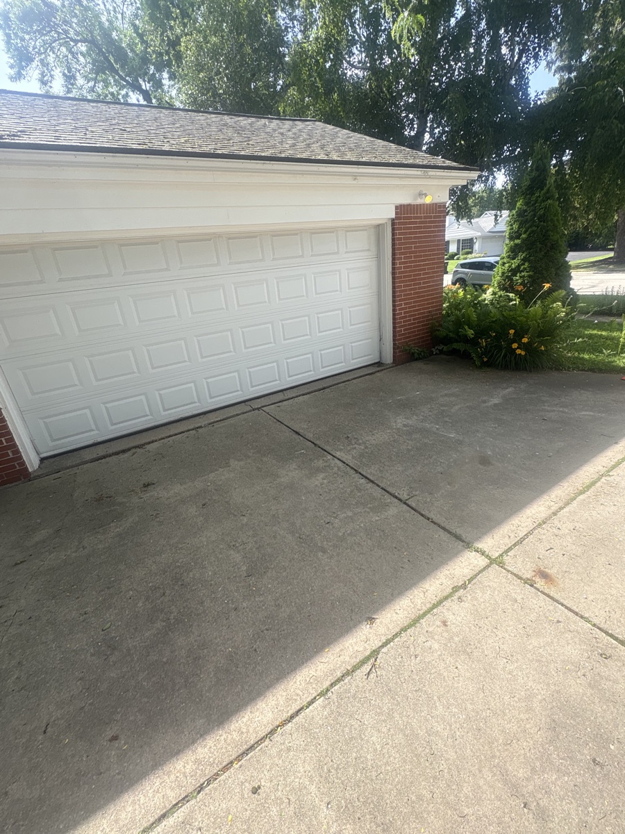 The same driveway swept clean after TT's Junk Removal hauled everything away